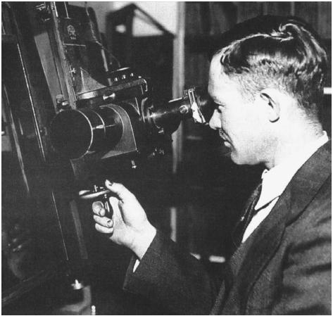 Clyde Tombaugh searches for Pluto at the Lowell Observatory in 1930. (AP/Wide World Photos. Reproduced by permission.)