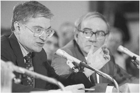 Stanley Pons (l) and Martin Fleischmann (r) testify at a congressional hearing about their cold fusion research (1989). (Photograph by Cliff Owen. © Bettmann/Corbis. Reproduced by permission.)
