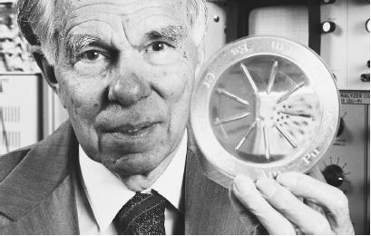 GLENN T. SEABORG HOLDS A SAMPLE CONTAINING ARTIFICIAL ELEMENTS BETWEEN 94 AND 102 ON THE PERIODIC TABLE. (Roger Ressmeyer/Corbis. Reproduced by permission.)