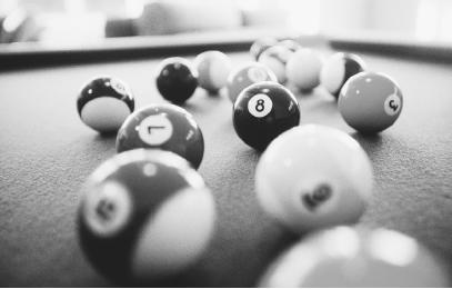 WHEN BILLIARD BALLS COLLIDE, THEIR HARDNESS RESULTS IN AN ELASTIC COLLISION—ONE IN WHICH KINETIC ENERGY IS CONSERVED. (Photograph by John-Marshall Mantel/Corbis. Reproduced by permission.)