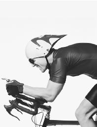 A PROFESSIONAL BICYCLE RACER'S STREAMLINED HELMET AND CROUCHED POSITION HELP TO IMPROVE AIR-FLOW, THUS INCREASING SPEED. (Photograph by Ronnen Eshel/Corbis. Reproduced by permission.)