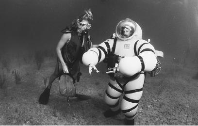 THIS YELLOW DIVING SUIT, CALLED A "NEWT SUIT," IS SPECIALLY DESIGNED TO WITHSTAND THE ENORMOUS WATER PRESSURE THAT EXISTS AT LOWER DEPTHS OF THE OCEAN. (Photograph by Amos Nachoum/Corbis. Reproduced by permission.)