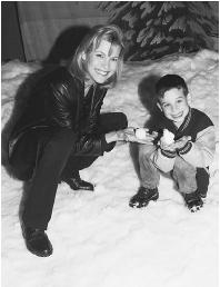 IF YOU HOLD A SNOWBALL IN YOUR HAND, AS VANNA WHITE AND HER SON ARE DOING IN THIS PICTURE, HEAT WILL MOVE FROM YOUR HAND TO THE SNOWBALL. YOUR HAND EXPERIENCES THIS AS A SENSATION OF COLDNESS. (Reuters NewMedia Inc./Corbis. Reproduced by permission.)