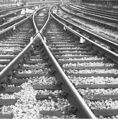 BECAUSE STEEL HAS A RELATIVELY HIGH COEFFICIENT OF THERMAL EXPANSION, STANDARD RAILROAD TRACKS ARE CONSTRUCTED SO THAT THEY CAN SAFELY EXPAND ON A HOT DAY WITHOUT DERAILING THE TRAINS TRAVELING OVER THEM. (Milepost 92 1/2/Corbis. Reproduced by permission.)