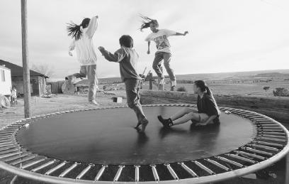 THE BOUNCE PROVIDED BY A TRAMPOLINE IS DUE TO ELASTIC POTENTIAL ENERGY. (Photograph by Kevin Fleming/Corbis. Reproduced by permission.)