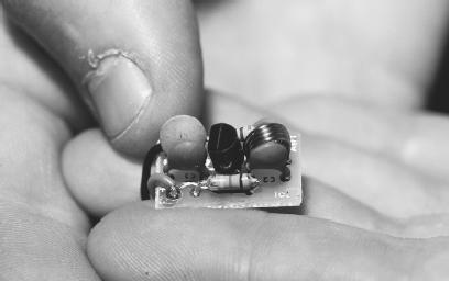 TINY LISTENING DEVICES, LIKE THE ONE SHOWN HERE, HAVE A HOST OF MODERN APPLICATIONS, FROM ELECTRONIC EAVESDROPPING TO ULTRASONIC STEREO SYSTEMS. (Photograph by Jeffrey L. Rotman/Corbis. Reproduced by permission.)