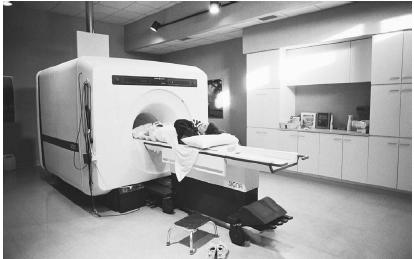 MAGNETIC RESONANCE IMAGING IS ONE TYPE OF DIAGNOSTIC TEST USED TO LOCATE TUMORS. (© Neal Preston/Corbis. Reproduced by permission.)