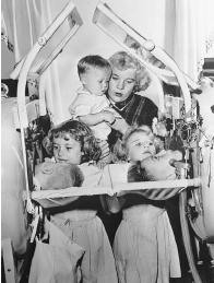 TWO CHILDREN ARE CONFINED TO IRON LUNGS AS THE RESULT OF INFECTION WITH POLIOVIRUS ; SIXOFTHE CHILDREN IN THIS ONE FAMILY WERE STRICKEN WITH THE VIRUS. AN EPIDEMIC DISEASE CAN AFFECT A LARGE PROPORTION OF A POPULATION, AS HAPPENED IN THE CASE OF POLIO IN THE MIDDLE OF THE TWENTIETH CENTURY. (&#xA9; Bettmann/Corbis. Reproduced by permission.)