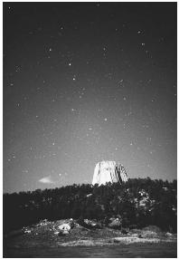 DEVILS TOWER, WITH THE BIG DIPPER VISIBLE IN THE NIGHT SKY. (© Jerry Schad/Photo Researchers. Reproduced by per mission.)