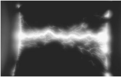 THE ELECTRIC DISCHARGE BETWEEN TWO METAL OBJECTS. (© P. Jude/Photo Researchers. Reproduced by permission.)