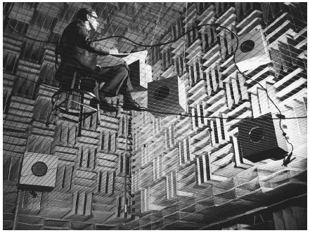 A scientist at Bell Telephone Laboratories in 1965 listening to music in a specially designed room that does not produce echoes or reverberations. (Reproduced by permission of AT&T Bell Laboratories.)