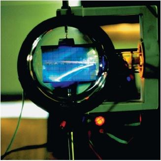 A demonstration of the effect of a magnetic field on an electron beam. (Reproduced by permission of Photo Researchers, Inc.)