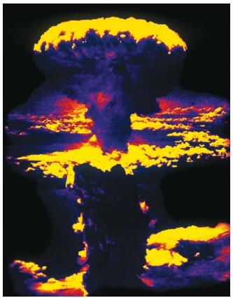 Computer-enhanced photo of the atom bomb blast over Nagasaki, Japan, on August 8, 1945, that helped bring World War II to a close. (Reproduced by permission of Photo Researchers, Inc.)