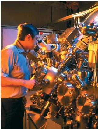 Electron spectrometer being used for chemical analysis. (Reproduced by permission of Photo Researchers, Inc.)