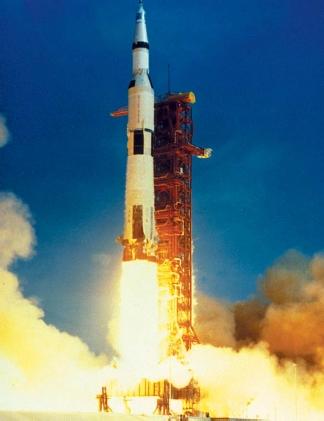 The liftoff of Apollo 11 from pad 39A at Kennedy Space Center on July 16, 1969, at 9:32 A.M. Crewmen Neil A. Armstrong, Michael Collins, and Edwin E. Aldrin Jr. were the first to land on the Moon. (Reproduced by permission of National Aeronautics and Space Administration.)