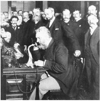 Alexander Graham Bell on the telephone at the formal opening of telephone service between New York and Chicago in 1892. (Reproduced by permission of National Aeronautics and Space Administration.)