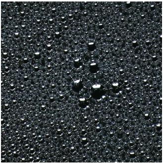 Droplets of mercury, the only liquid metal. (Reproduced by permission of Photo Researchers, Inc.)