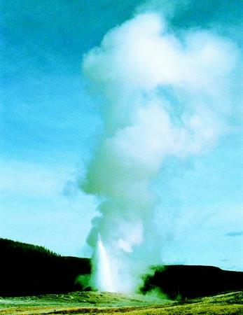 Considered the most famous geyser in the world, Old Faithful, in Yellowstone National Park, Wyoming, shoots water and steam up to 184 feet about every 90 minutes. PHOTOGRAPH REPRODUCED BY PERMISSION OF THE CORBIS CORPORATION.