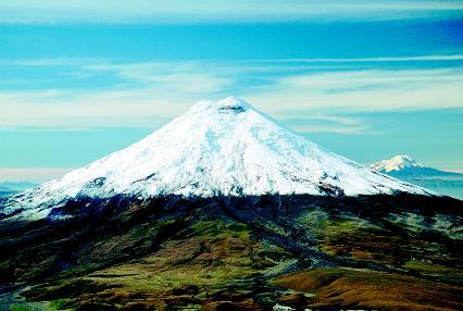 The world's highest active volcano, Mount Cotopaxi, rises 19,388 feet above the surrounding highland plain in central Ecuador. Mount Cotopaxi is a stratovolcano with an almost perfectly symmetrical cone. PHOTOGRAPH REPRODUCED BY PERMISSION OF THE CORBIS CORPORATION.