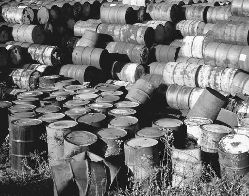 Rusty barrels containing toxic materials can release toxins into the soil. Using microbes to clean up such waste has become a common practice.