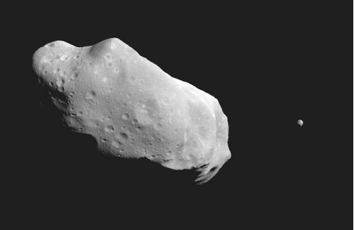 Galileo snapped this photo of the asteroid Ida. The tiny object at right is Idas satellite Dactyl, which is slightly less than a mile across.