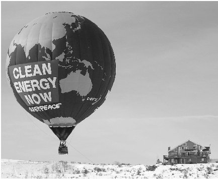 Greenpeace activists fly a hot-air balloon over Park City, Utah, with a message stressing the need to shift to clean and renewable energy sources.