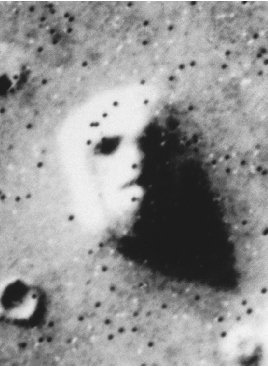A satellite photo shows the face on Mars, one of several of the planets volcanic surface features.