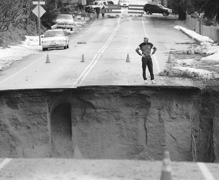 Global warming is responsible for very destructive storms. This huge sinkhole resulted from large amounts of rain during a severe storm in Shoreline, Washington.