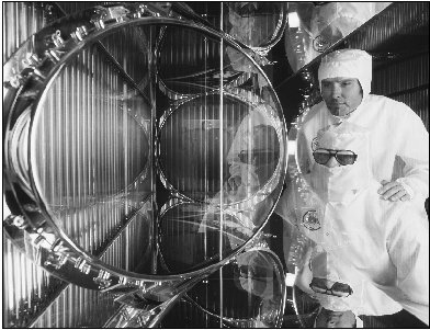 Technicians inspect the inside of the Nova laser, built by the Lawrence Livermore National Laboratory. When activated, the beam is thousands of times brighter than the sun.
