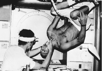 Even routine activities like a medical exam are a challenge in a weightless environment like that found on the space station Skylab.