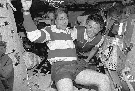 After a few months onboard Mir, American astronaut John Blaha (left) began to exhibit hostility toward fellow crew members and other symptoms of serious depression.