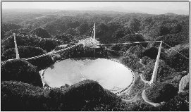 The massive radio telescope at Arecibo in Puerto Rico can detect the source of extremely distant radio waves.